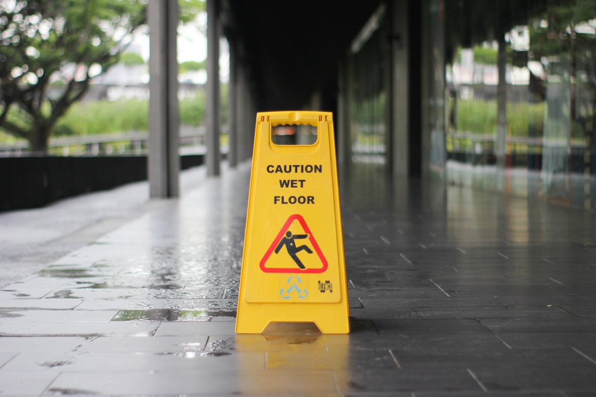 Wet floor warning sign in a public walkway